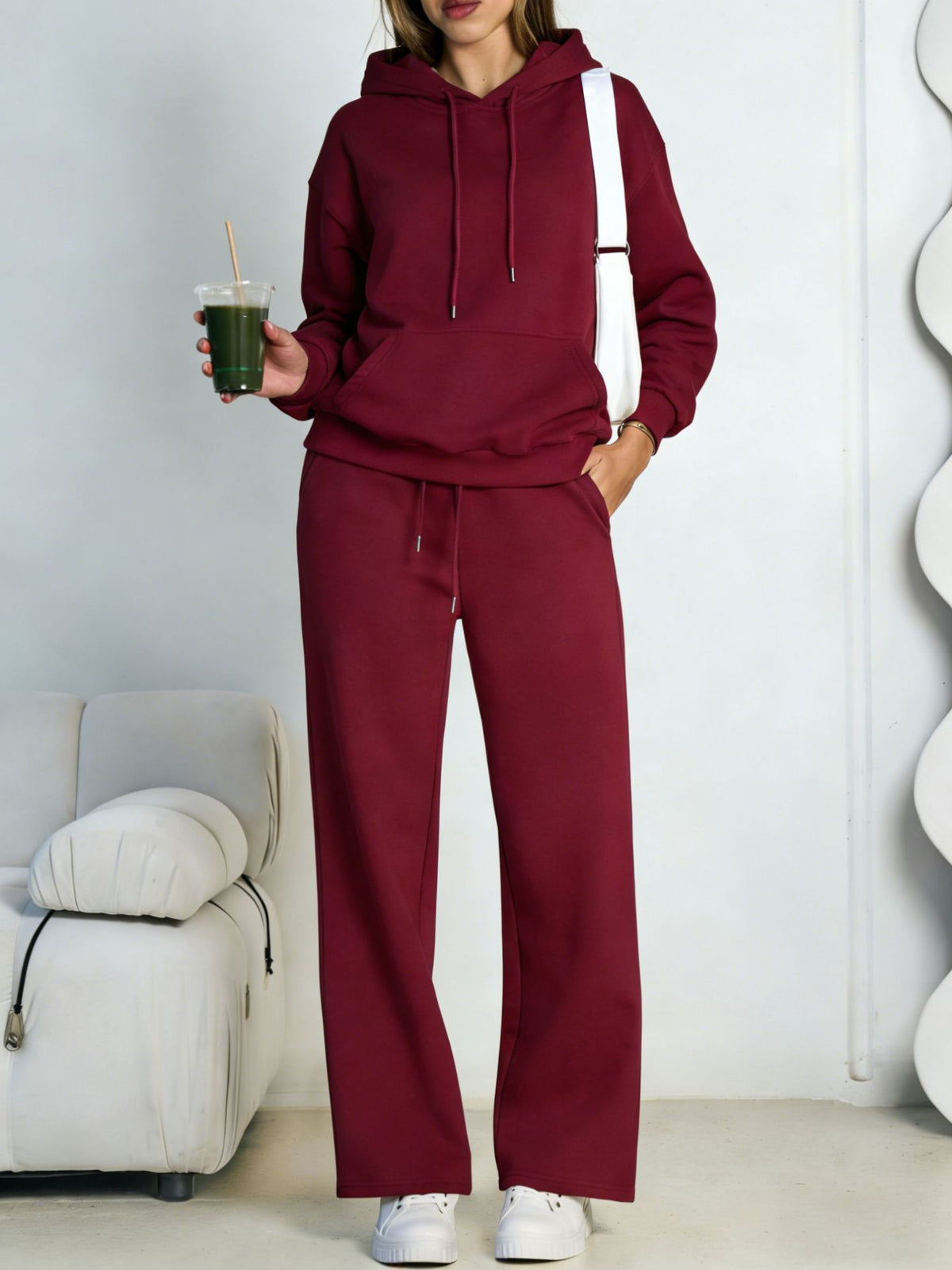 Burgundy fleece hooded sweatshirt and wide-leg sweatpants set worn by a model