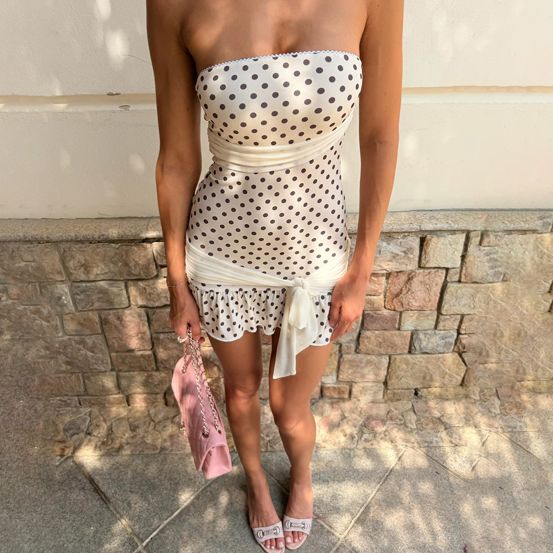 Side angle showing the slim waist line of the sleeveless dress