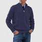 Dark blue mens acrylic knit quarter zip stand collar pullover sweater worn by a standing male model