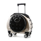 Gold champagne pet carrier on wheels with a black paw-print window pierced with air holes and a telescopic handle