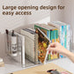 Hand pulling a book out of the open top of a clear divided book organizer beside a pen holder on a desk