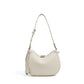 Off white pebbled leather crescent bag with a long adjustable shoulder strap and metal tipped leather tab
