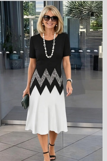 Floral print short sleeve dress showing the knee length overlapping front hem