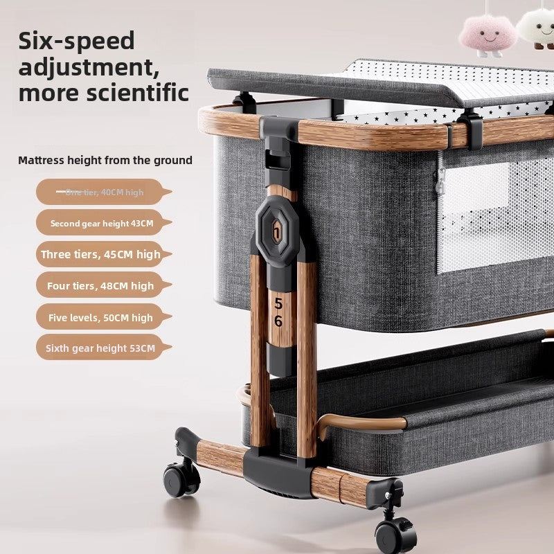 Gray baby crib with a wood grain frame and a panel listing six mattress height settings from 40 to 53 cm