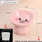 Little pig ceramic raised pet bowl in pink with round ears and a painted snout, 14 by 13.5 cm and 11.5 cm high
