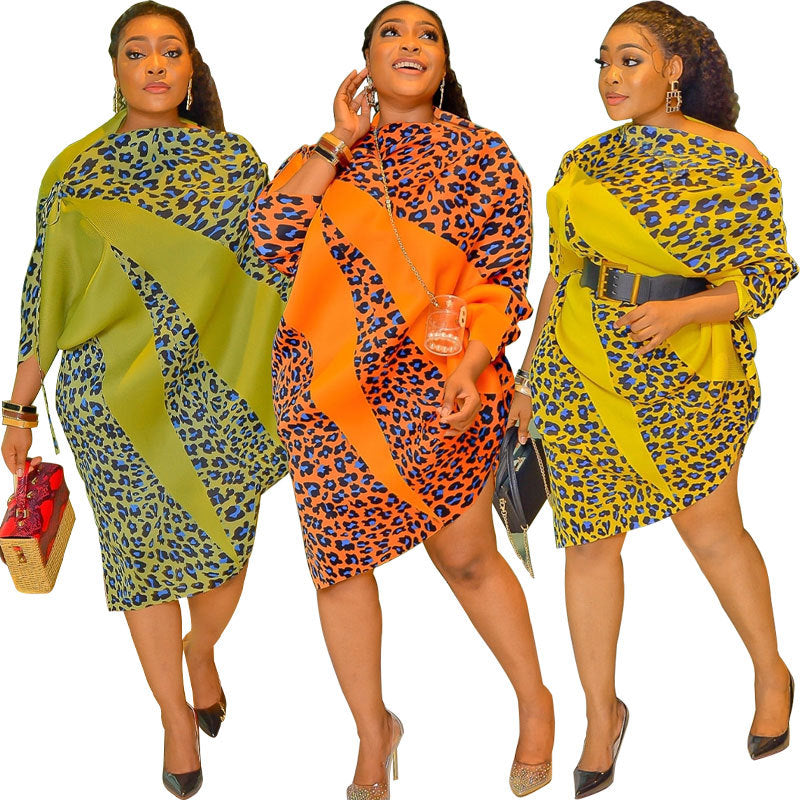 Loose leopard print midi dress with a colour-block swirl and long dolman sleeves