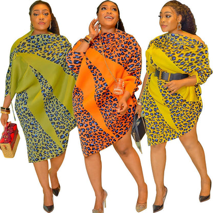 Loose leopard print midi dress with a colour-block swirl and long dolman sleeves