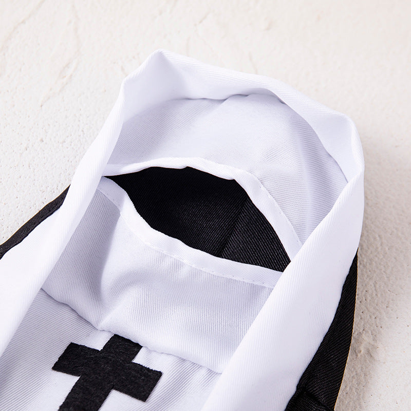 Close up of the white hood trim, white front panel and black cross of the polyester pet nun costume