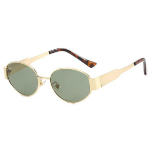 Gold metal oval sunglasses with green lenses and tortoise temple tips on a white background