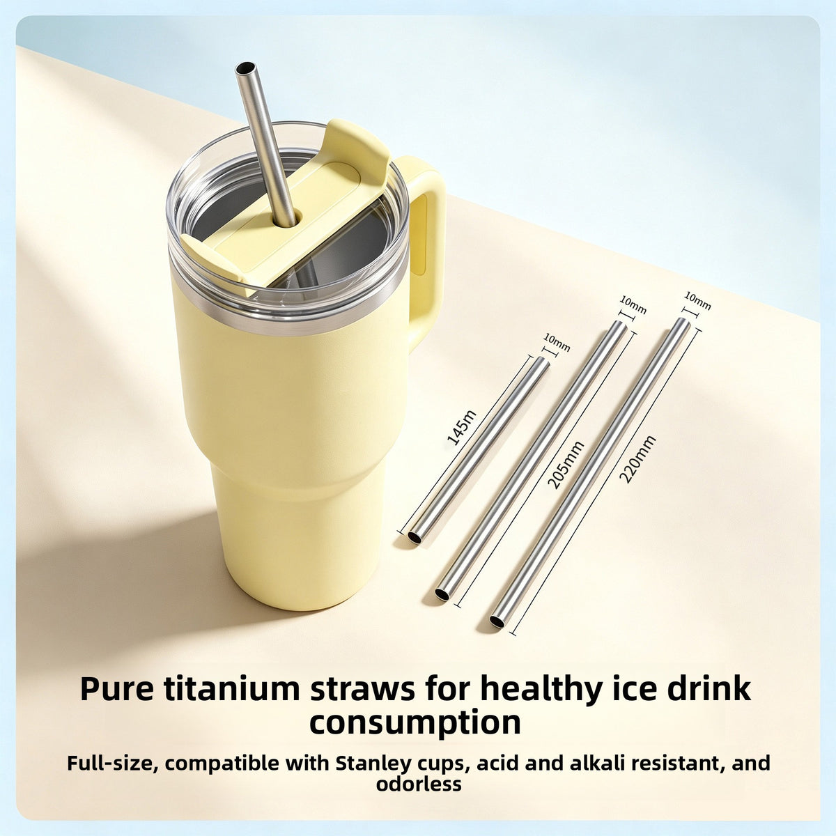 Three titanium straws of 145, 205 and 220 mm beside a yellow handled tumbler with a straw in the lid