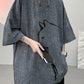 Side profile of the linen blend t-shirt showing the short set sleeve