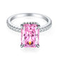Front view of an elongated radiant pink stone ring on an S925 sterling silver pave band, rhodium finish