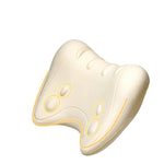 Ivory contoured foam neck pillow with raised oval nodes outlined in gold on a white background