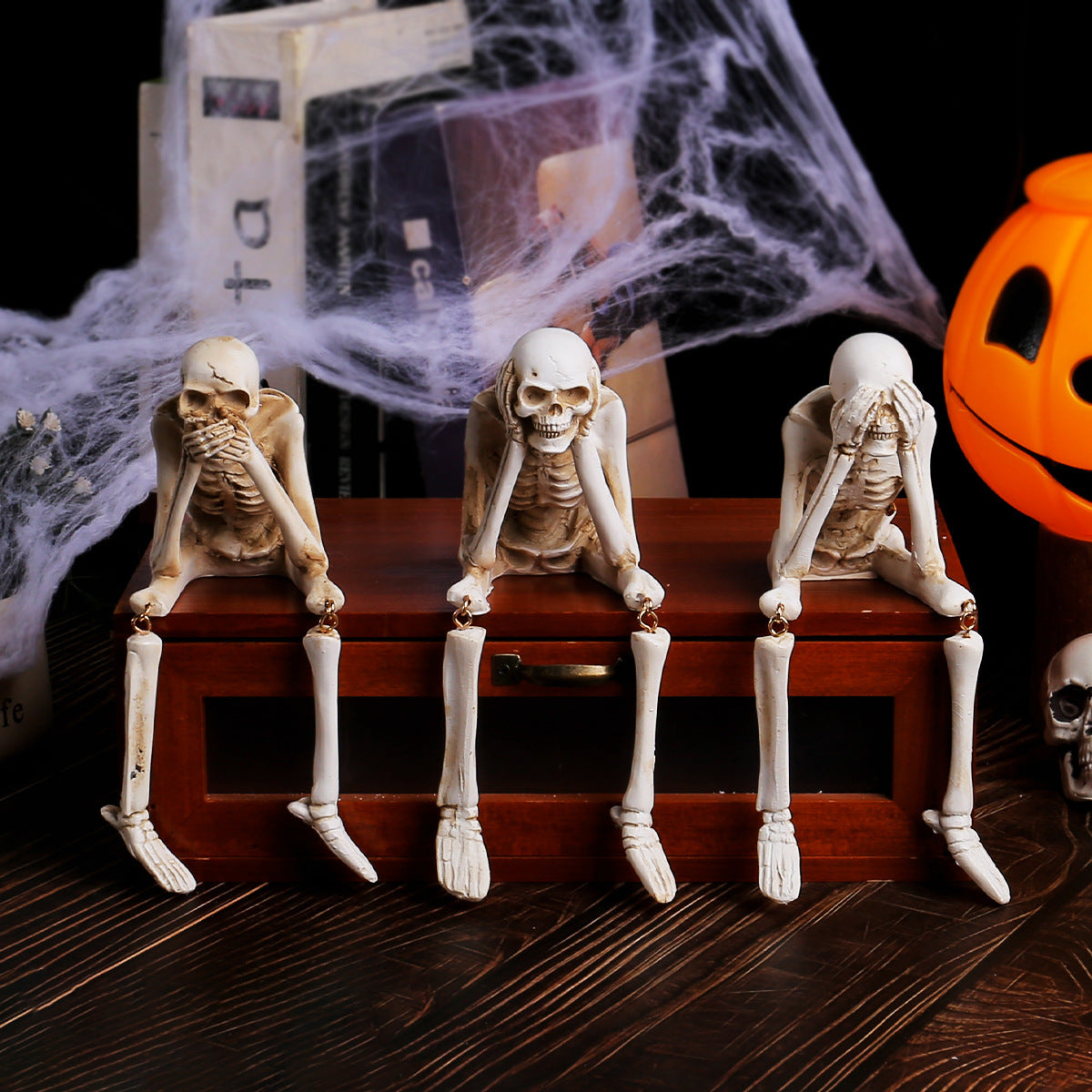 Speak no evil resin skeleton figurine covering its mouth