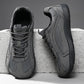 Dark gray mesh lace-up sneakers with matte overlays and a dark flat sole on a concrete block, size 41 option photo