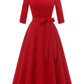 Vintage swing dress laid flat showing the fitted bodice and full pleated A-line skirt