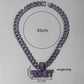 Money letter pendant held to show its size in the hand
