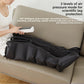 Zipped black leg wrap on a sofa with a hand holding the white handset
