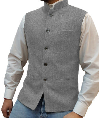 Silver herringbone stand collar vest over a white shirt, size S