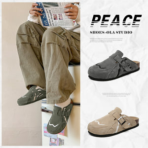 Dark gray closed toe backless clog mule with wavy stitched overlays, profile