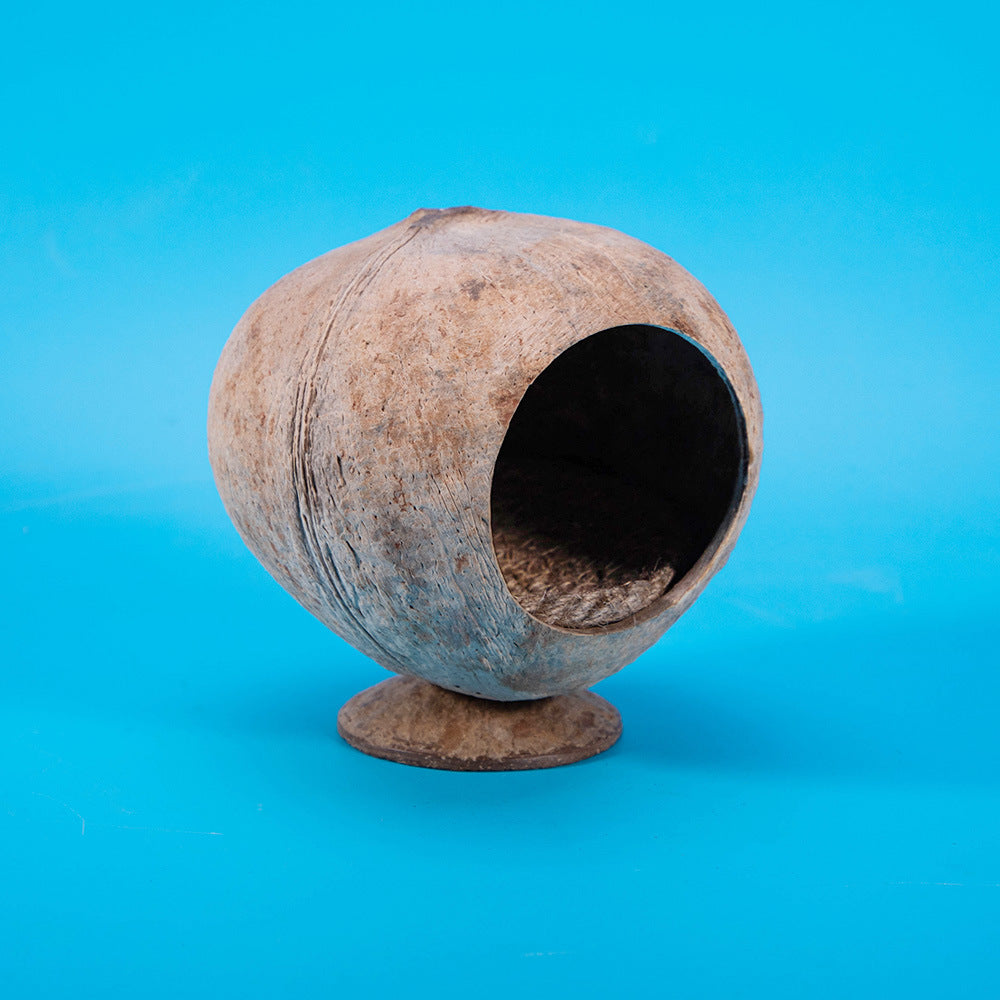 Whole coconut shell hide sanded smooth with a cut round entrance for small pets