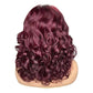 Back view of the burgundy curly wig on a white background, loose spiral curls across the back