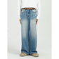 Blue denim jeans shown at an angle to show the cut and wash