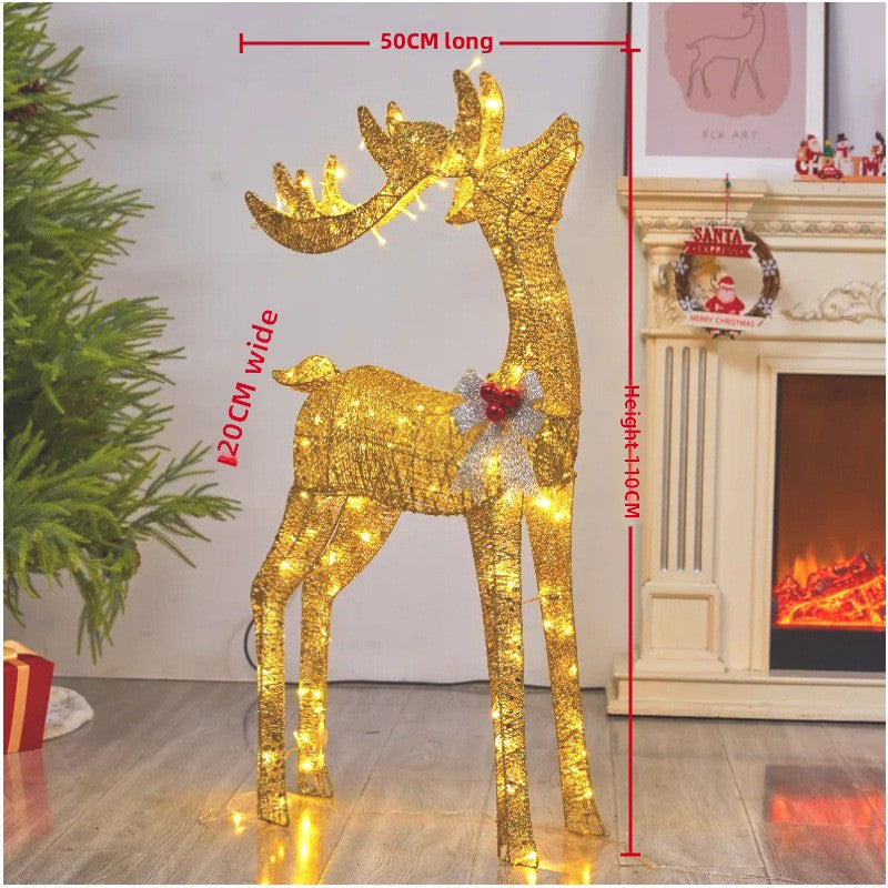 Golden lit reindeer beside a fireplace, 110 cm tall, 50 cm long and 20 cm wide on the maker's drawing, extended variant