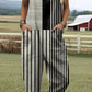 Printed button strap overall jumpsuit with a loose fit and tapered roll up legs