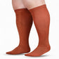 Pair of plus size knee high compression socks worn on the legs on a white background