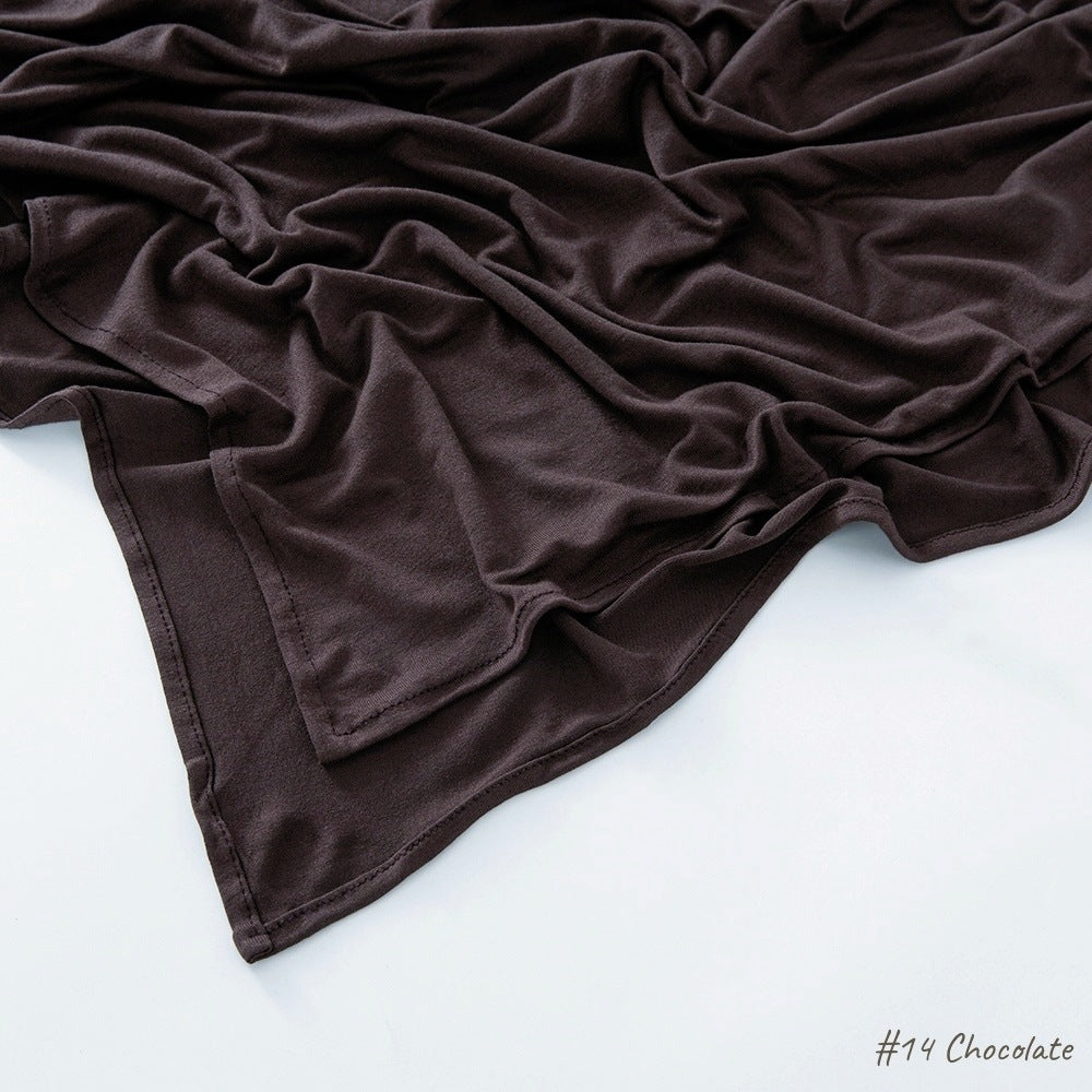 Modal cotton headscarf wrap draped to show length and the smooth fall of the breathable jersey knit