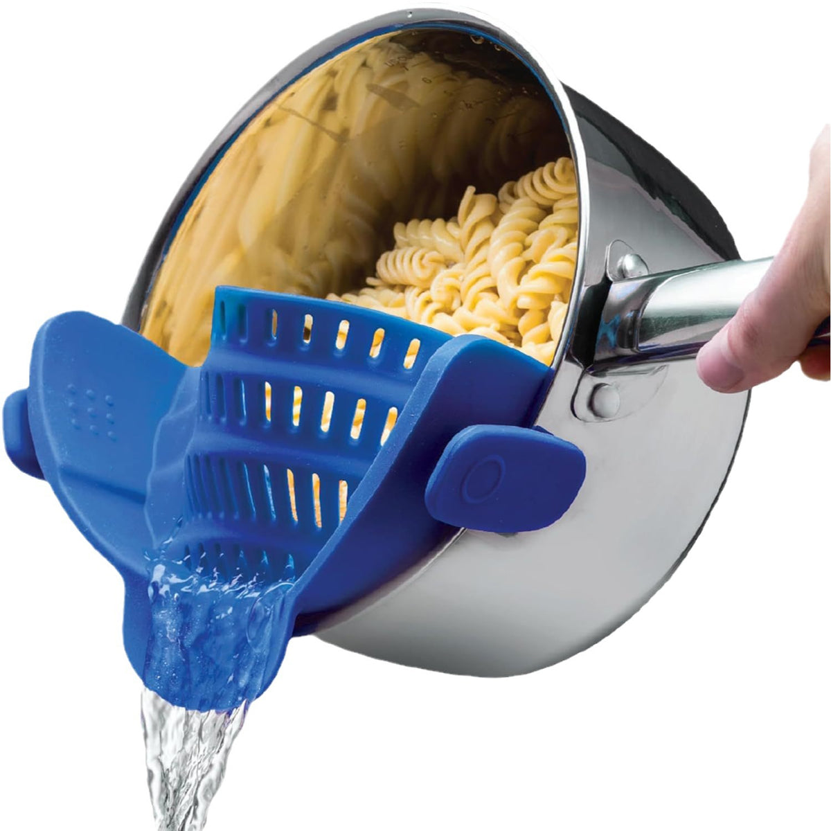 Blue silicone clip-on pot strainer on a stainless steel pot draining pasta, water pouring from the spout