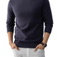 Navy blue slim fit crew neck knit sweater with ribbed cuffs and hem on a model wearing white trousers