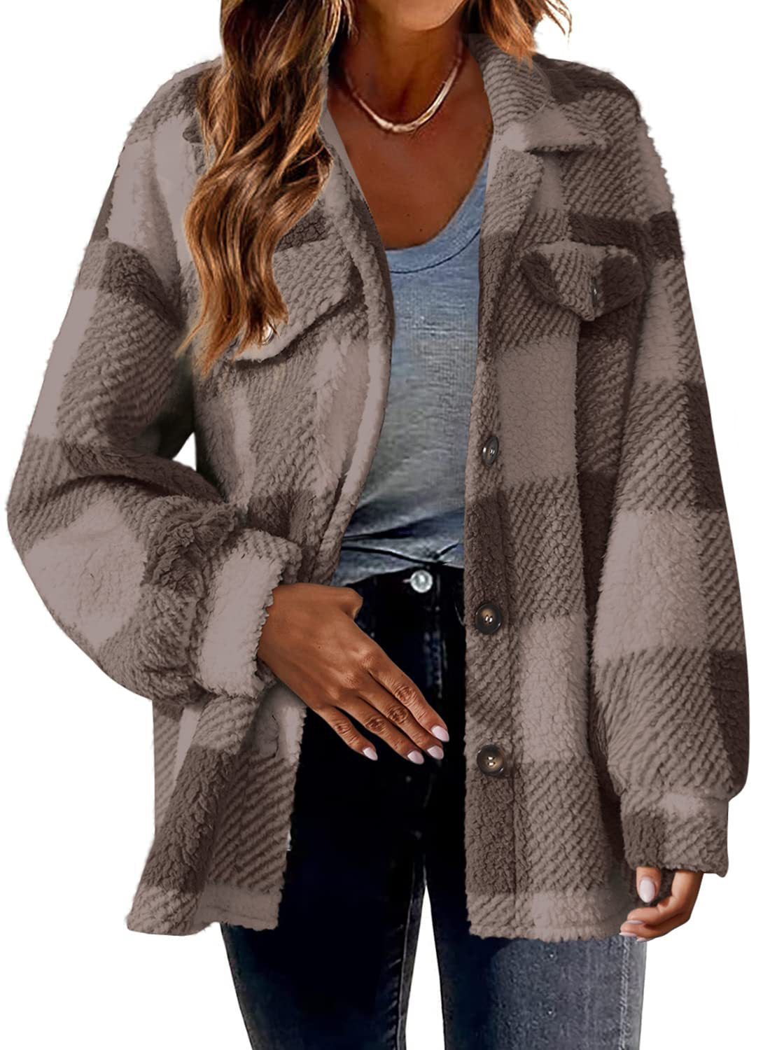 Loose fit plaid sherpa fleece jacket, hip length silhouette worn over denim