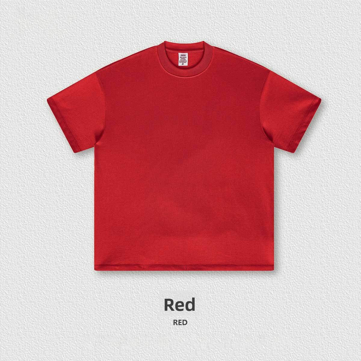 Flat lay of the heavyweight 305g cotton crew neck tee showing the boxy oversized cut and ribbed collar