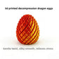 Group of 3D printed dragon egg fidget toys in several metallic colors