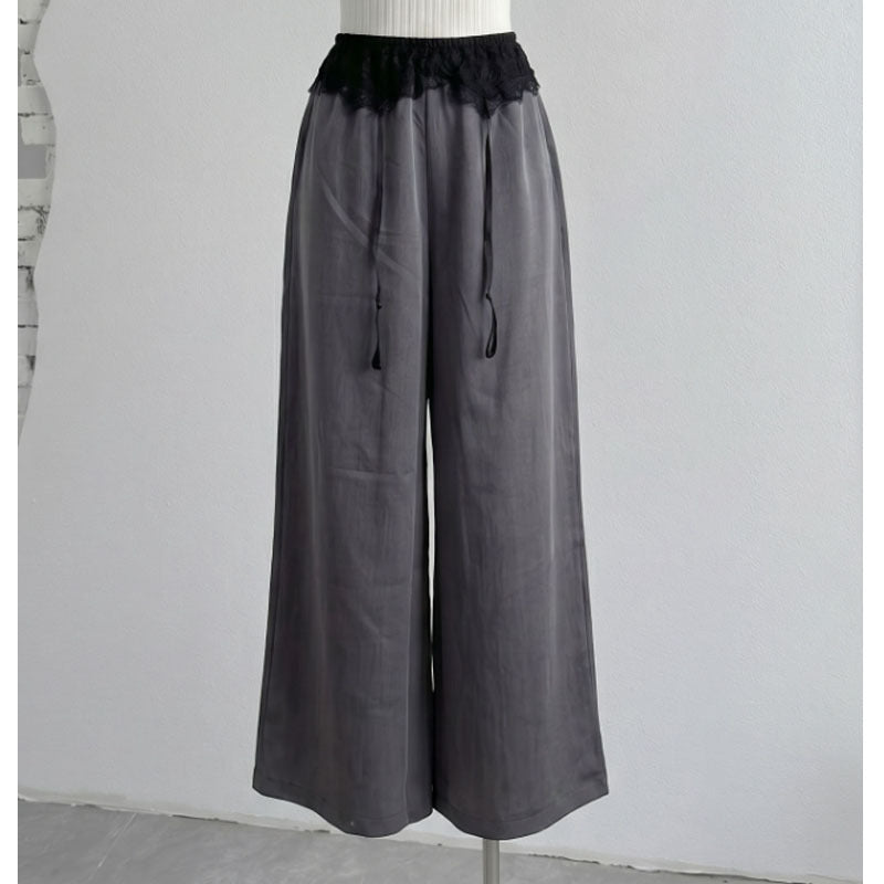 Full-length gray wide-leg pants with black scalloped lace front waist panel