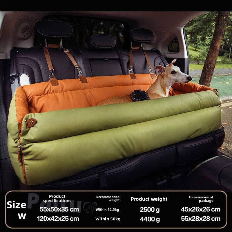 Green and orange dog car bolster bed strapped across a rear seat with a dog resting inside