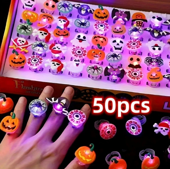 Fifty piece box of Halloween themed LED light up finger rings in assorted designs