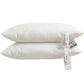 Two white cotton bed pillows stacked flat, 48 by 74 cm, with paper care tags attached