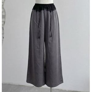 Gray high-waist wide-leg pants on mannequin with black lace front waist
