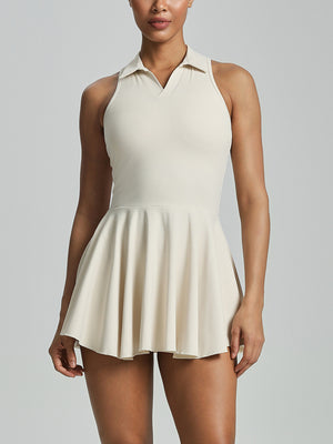 Milky apricot tennis dress front view with open collar and flared skirt
