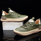 Green lace up sneakers displayed on a white block, pale midsole wrapping the shoe