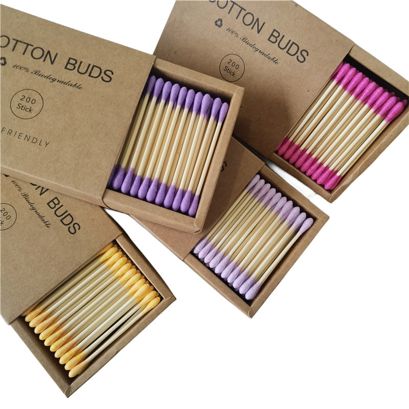 Side profile of double-headed makeup swab showing pointed tip and rounded tip ends