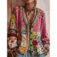 Women's V neck button front knit cardigan shown open over a white top with wooden buttons