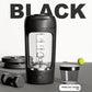 Electric protein shaker cup with a printed scale, held in one hand