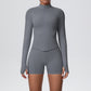 Back view of the fitted seamless zip jacket and high waist shorts set