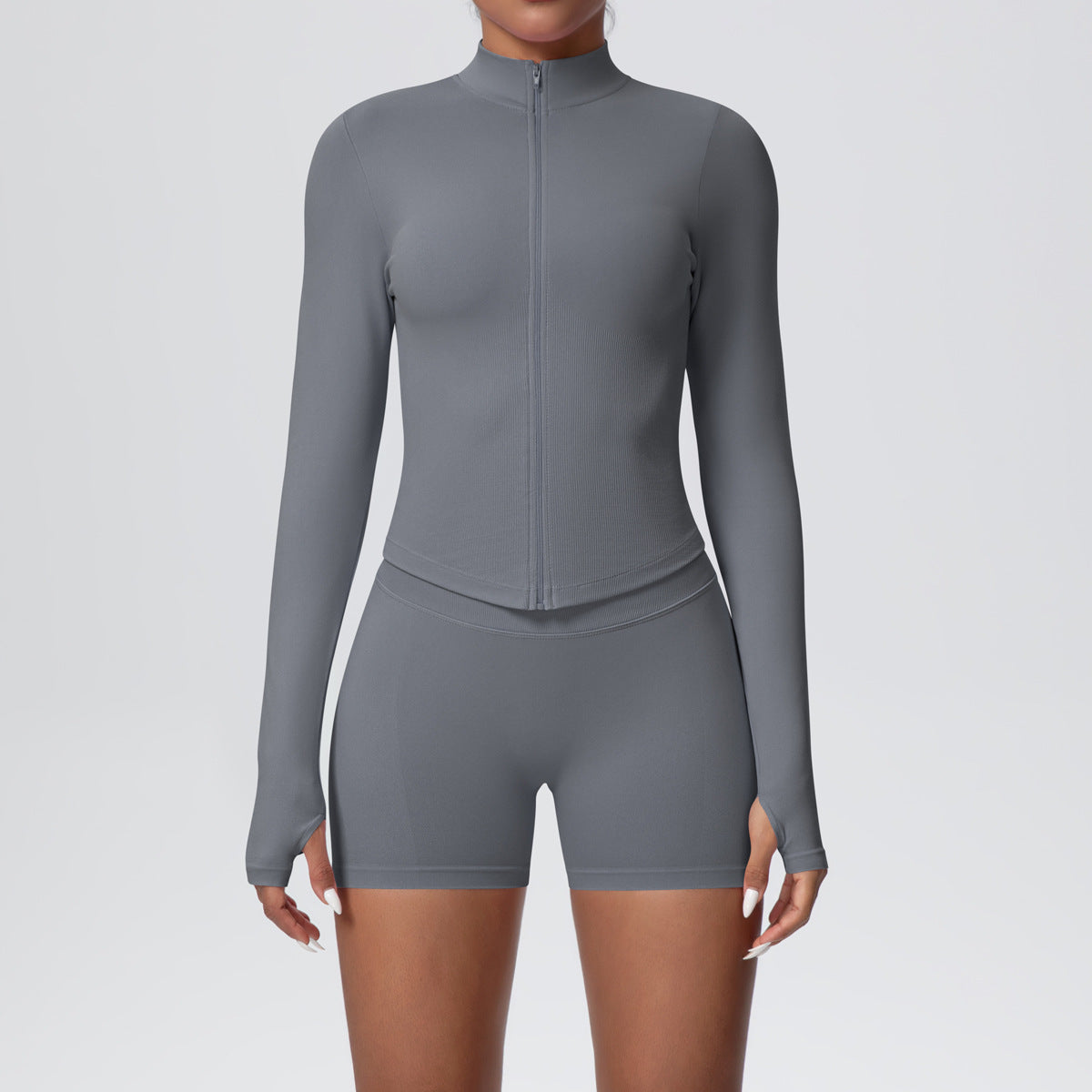 Back view of the fitted seamless zip jacket and high waist shorts set