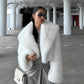 White vegan fur short jacket with long pile and wide shawl collar worn open