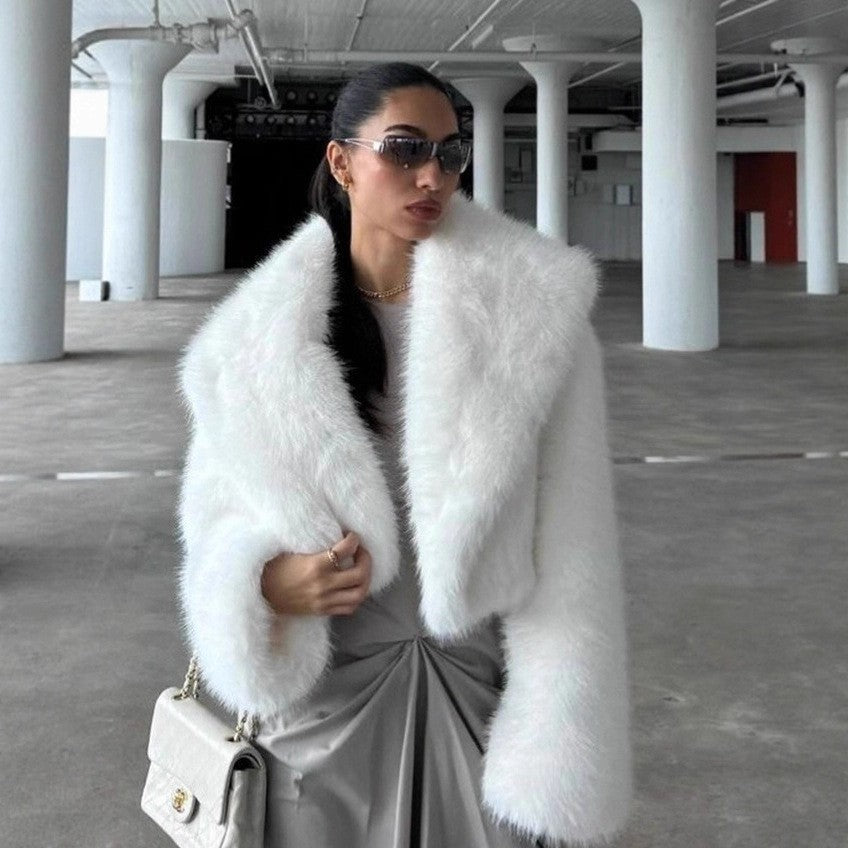 White vegan fur short jacket with long pile and wide shawl collar worn open